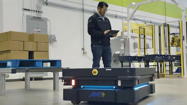 An engineer supervises the operation of MiR’s autonomous mobile robot, designed for efficient material handling in industrial environments.