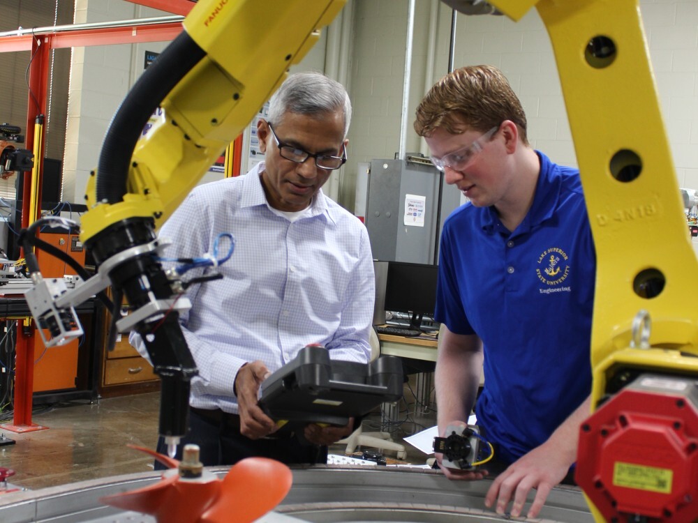 LSSU Jim Devaprasad with Wyatt Fremlin FANUC robots AMT_portrait