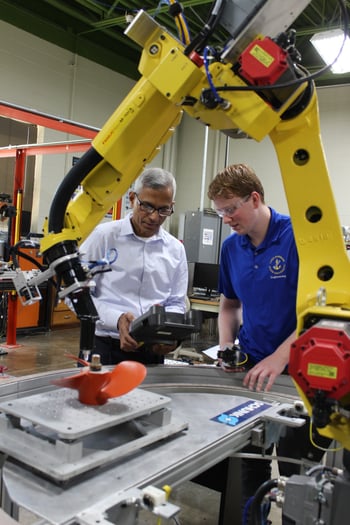 LSSU Jim Devaprasad with Wyatt Fremlin FANUC robots AMT_sm